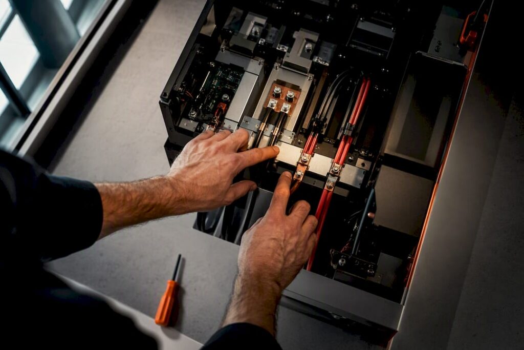 Technician tracing AC and DC energy paths